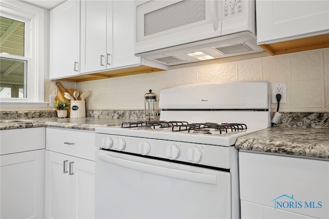 1247 Hugo St, Maumee, OH 43537 - kitchen featuring white appliances, white cabinetry, and backsplash