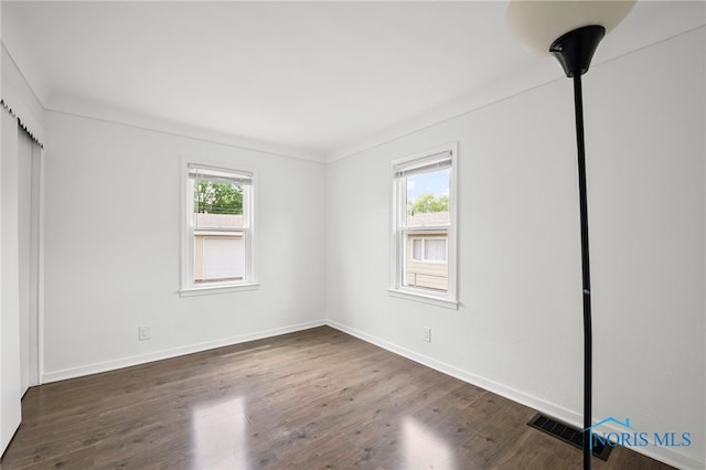 1247 Hugo St, Maumee, OH 43537 - unfurnished bedroom with wood finished floors and baseboards