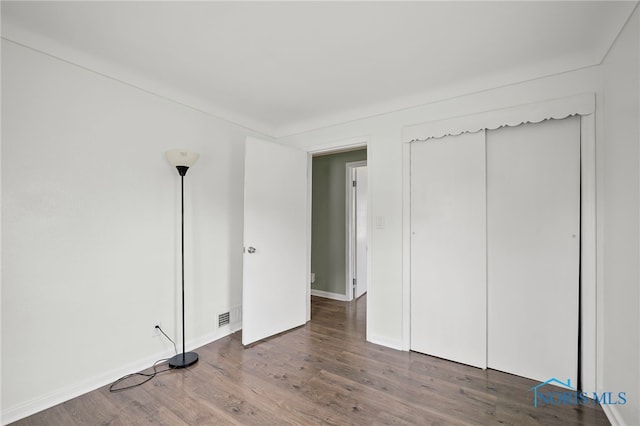 1247 Hugo St, Maumee, OH 43537 - unfurnished bedroom featuring wood finished floors and baseboards