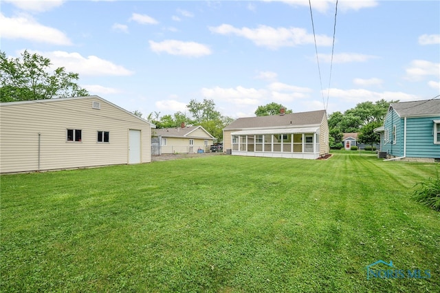1247 Hugo St, Maumee, OH 43537 - view of yard with a sunroom and an outdoor structure