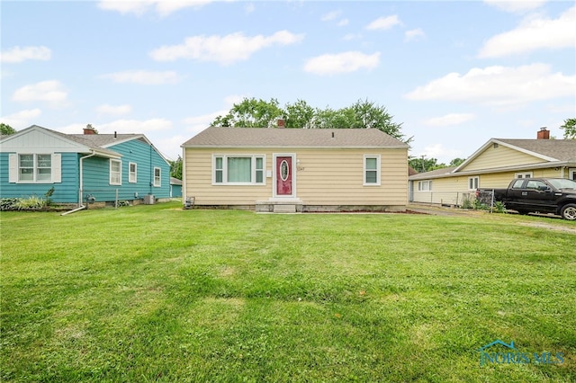 1247 Hugo St, Maumee, OH 43537 - view of front facade with a front lawn