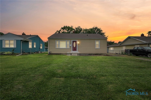 1247 Hugo St, Maumee, OH 43537 - view of front facade with a front lawn