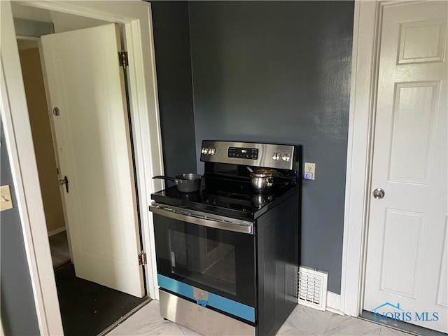 2615 Greenway St, Toledo, OH 43607 - kitchen with electric range and light marble finish flooring
