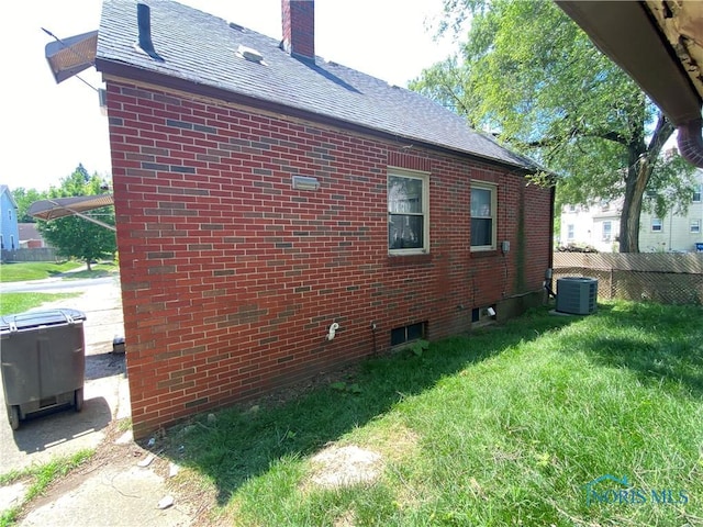 2534 Montebello Rd, Toledo, OH 43607 - view of side of home with brick siding, roof with shingles, and a chimney