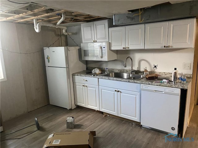2534 Montebello Rd, Toledo, OH 43607 - kitchen featuring white appliances, white cabinetry, dark wood-style flooring, and light stone counters