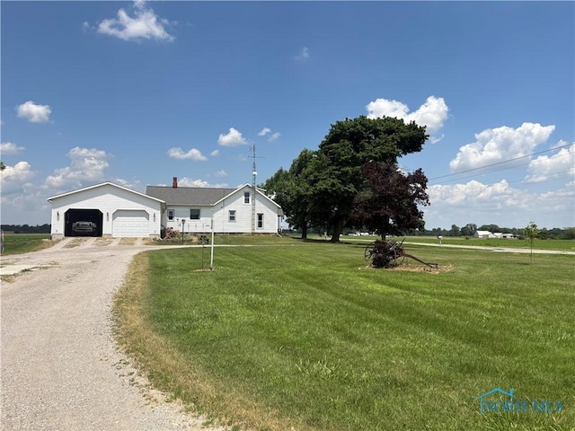 12567 County Road 8, Montpelier, OH 43543 - single story home featuring a front yard, driveway, and a detached garage