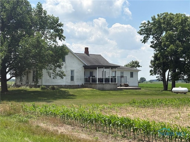 12567 County Road 8, Montpelier, OH 43543 - rear view of property with a yard and a chimney