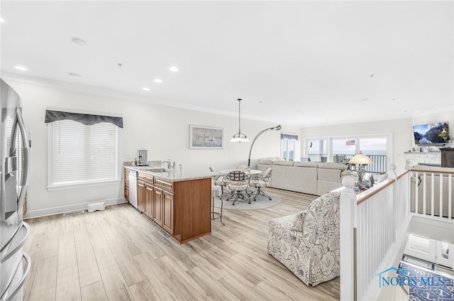11200 E Bayshore Rd Unit D, Marblehead, OH 43440 - kitchen with brown cabinets, crown molding, stainless steel fridge with ice dispenser, light wood-type flooring, and open floor plan