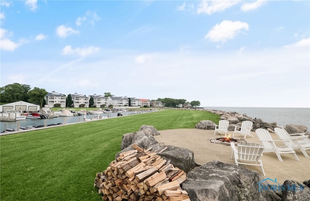 11200 E Bayshore Rd Unit D, Marblehead, OH 43440 - view of patio featuring a fire pit and a water view