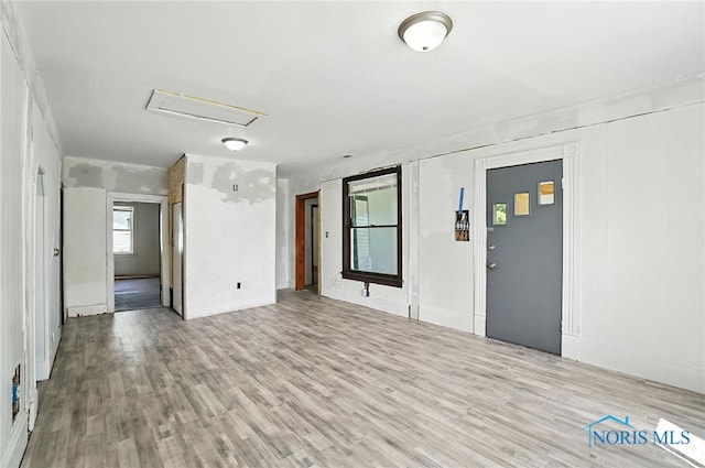 709 W Jackson St, Paulding, OH 45879 - unfurnished room featuring wood finished floors and attic access