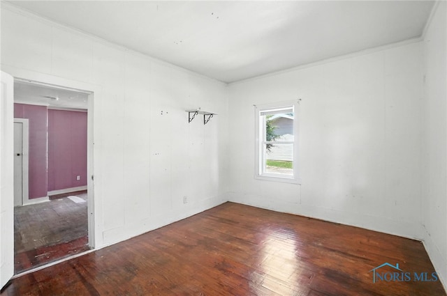 709 W Jackson St, Paulding, OH 45879 - spare room with hardwood / wood-style flooring and ornamental molding