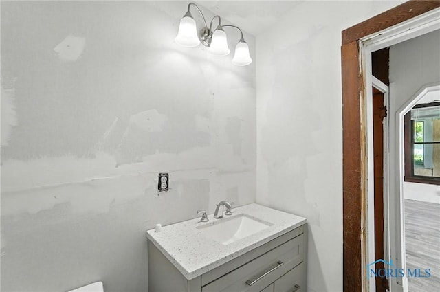 709 W Jackson St, Paulding, OH 45879 - half bathroom featuring vanity and a chandelier