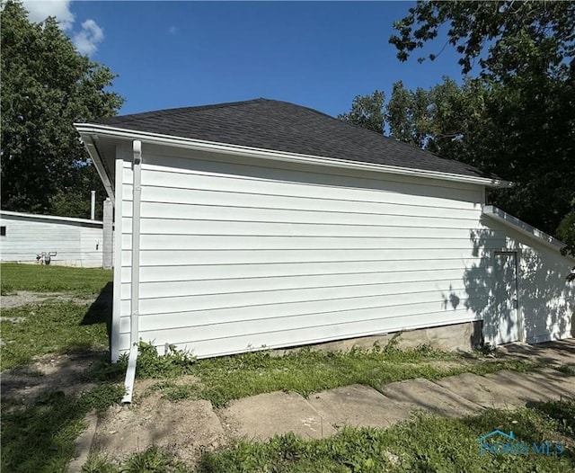 335 E N St, Mcclure, OH 43534 - view of side of home with roof with shingles and a lawn