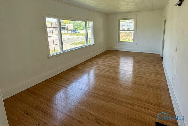 335 E N St, Mcclure, OH 43534 - empty room with wood finished floors and crown molding
