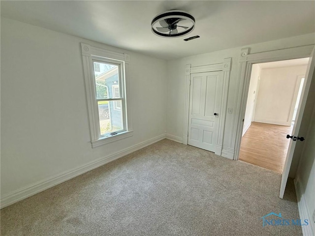 335 E N St, Mcclure, OH 43534 - unfurnished bedroom featuring carpet floors and a closet
