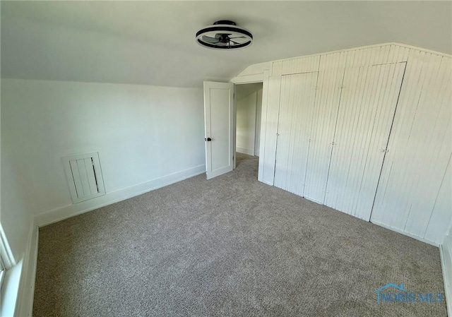 335 E N St, Mcclure, OH 43534 - unfurnished bedroom featuring lofted ceiling and carpet floors
