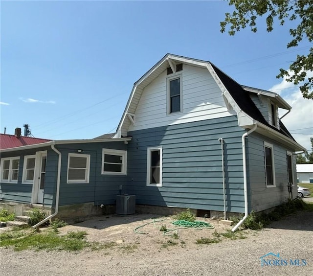 335 E N St, Mcclure, OH 43534 - view of side of property with a cooling unit and a gambrel roof