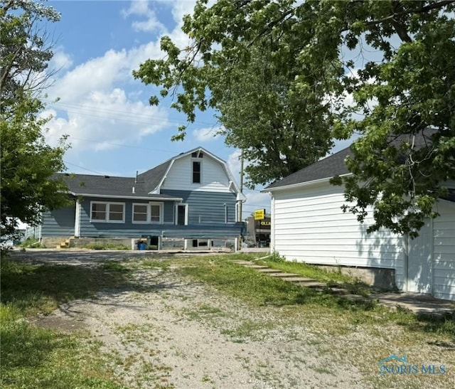 335 E N St, Mcclure, OH 43534 - rear view of property with a gambrel roof