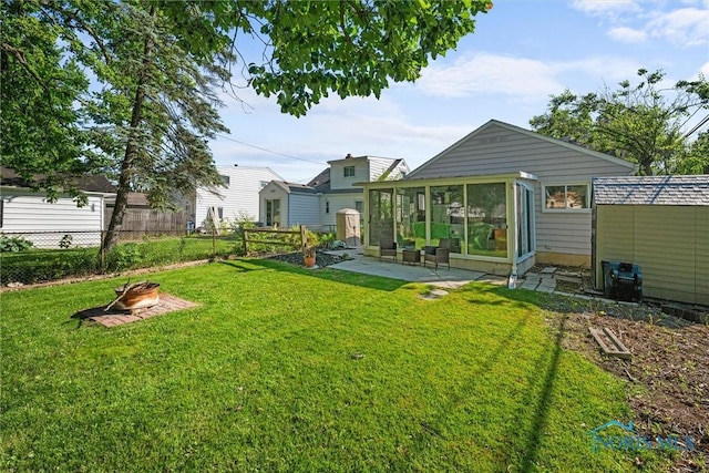2958 Penrose Ave, Toledo, OH 43614 - view of yard with an outdoor fire pit, a patio area, and a sunroom
