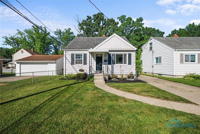 2958 Penrose Ave, Toledo, OH 43614 - bungalow-style home with board and batten siding and a garage