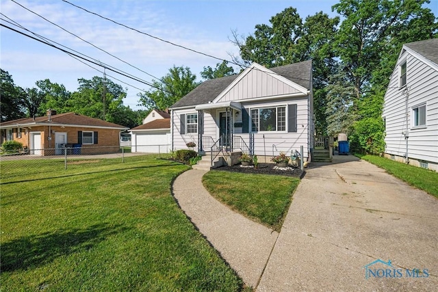 2958 Penrose Ave, Toledo, OH 43614 - bungalow-style home with board and batten siding and roof with shingles