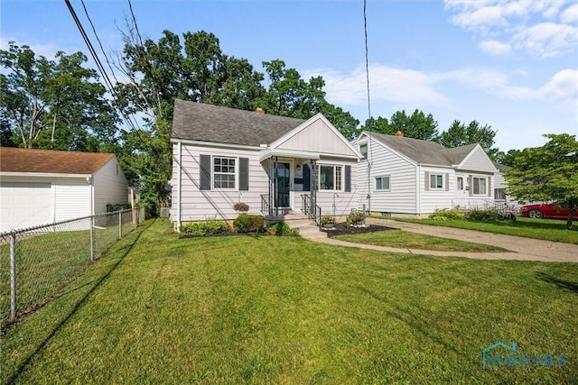 2958 Penrose Ave, Toledo, OH 43614 - view of front of home with a garage and a shingled roof