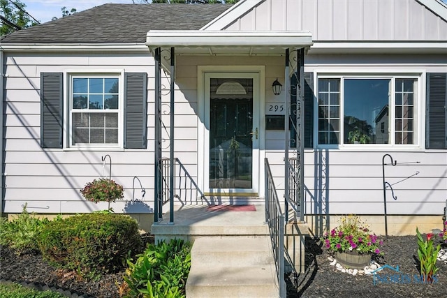 2958 Penrose Ave, Toledo, OH 43614 - property entrance featuring a shingled roof and board and batten siding
