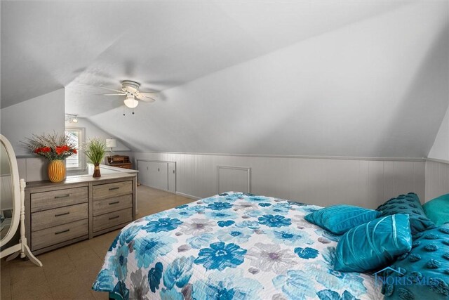 2958 Penrose Ave, Toledo, OH 43614 - bedroom with vaulted ceiling, a ceiling fan, wainscoting, and light flooring