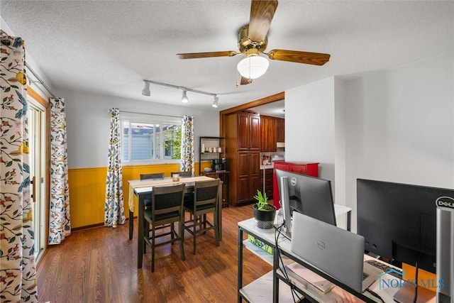 2958 Penrose Ave, Toledo, OH 43614 - dining area with wood finished floors, a wainscoted wall, ceiling fan, rail lighting, and a textured ceiling