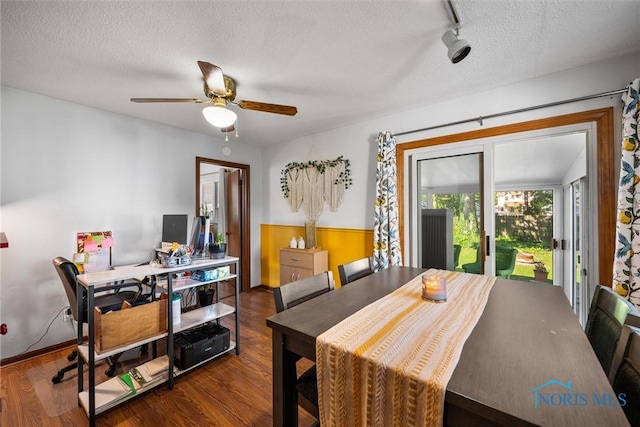 2958 Penrose Ave, Toledo, OH 43614 - dining space featuring a textured ceiling, wood finished floors, ceiling fan, a wainscoted wall, and a desk
