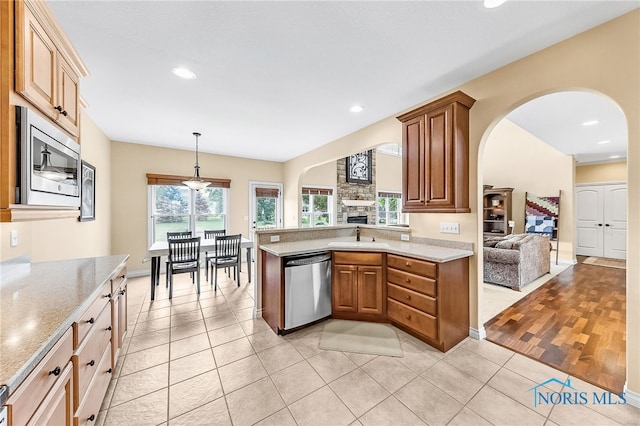 9701 Preakness Ln, Whitehouse, OH 43571 - kitchen with stainless steel appliances, arched walkways, recessed lighting, open floor plan, and light tile patterned floors