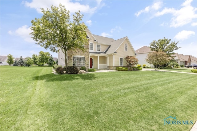 9701 Preakness Ln, Whitehouse, OH 43571 - traditional-style house with stone siding and a front yard