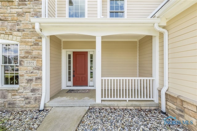9701 Preakness Ln, Whitehouse, OH 43571 - doorway to property with stone siding and a porch