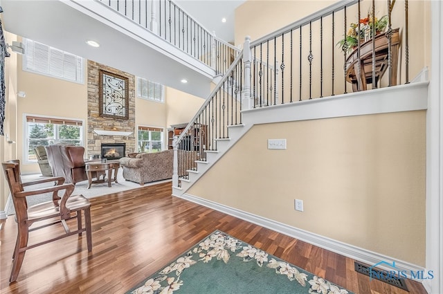 9701 Preakness Ln, Whitehouse, OH 43571 - stairway with a towering ceiling, a fireplace, wood finished floors, and recessed lighting