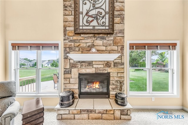 9701 Preakness Ln, Whitehouse, OH 43571 - carpeted living area featuring baseboards and a stone fireplace