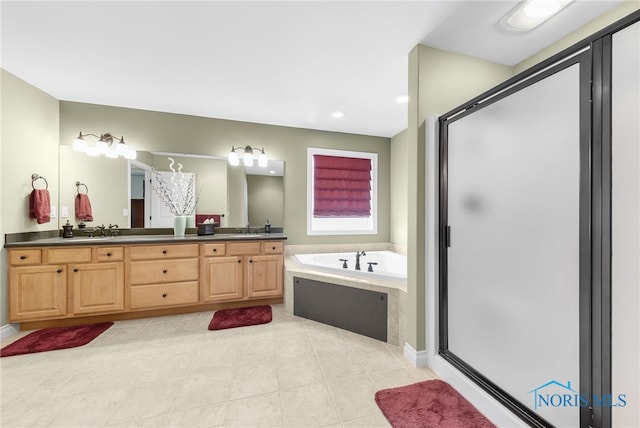 9701 Preakness Ln, Whitehouse, OH 43571 - full bathroom featuring a garden tub, double vanity, a shower stall, tile patterned floors, and recessed lighting