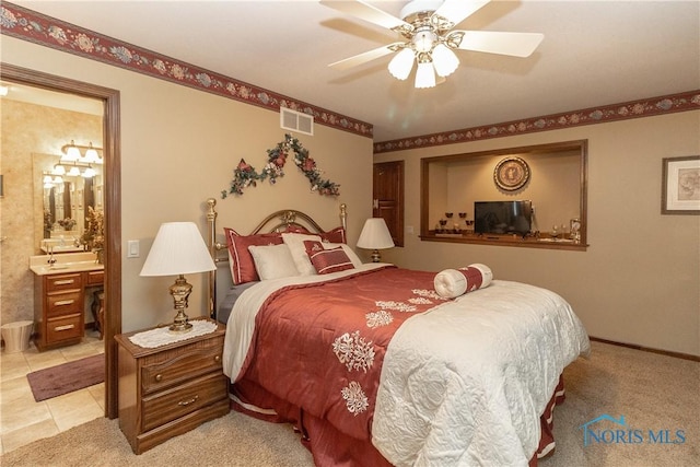 5303 Spring Crk, Sylvania, OH 43560 - bedroom with connected bathroom and ceiling fan