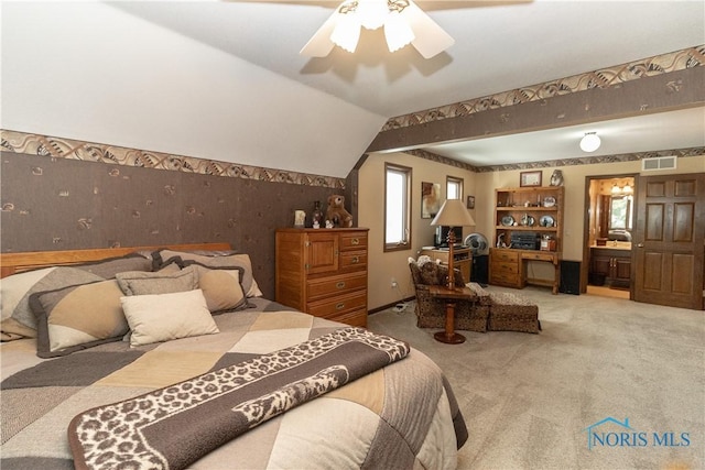 5303 Spring Crk, Sylvania, OH 43560 - carpeted bedroom with wallpapered walls, ceiling fan, ensuite bath, and lofted ceiling
