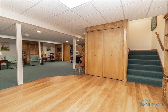 5303 Spring Crk, Sylvania, OH 43560 - unfurnished living room featuring stairs, wood finished floors, recessed lighting, and a drop ceiling