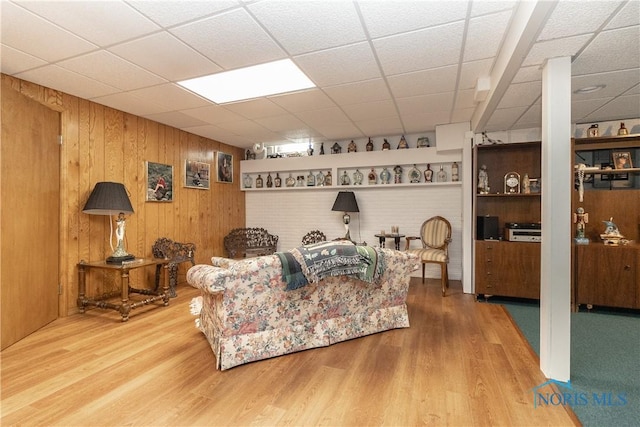 5303 Spring Crk, Sylvania, OH 43560 - living area with wood walls, wood finished floors, and a drop ceiling