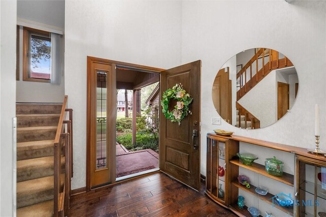 7118 Jamesford Dr, Toledo, OH 43617 - entrance foyer with stairs, dark wood-style flooring, and a towering ceiling