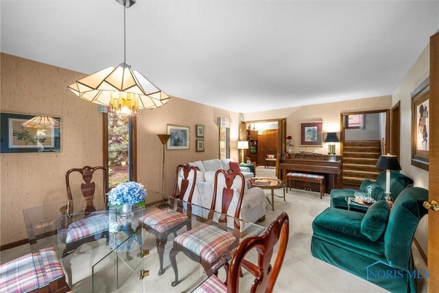 7118 Jamesford Dr, Toledo, OH 43617 - carpeted dining room featuring stairs and a chandelier
