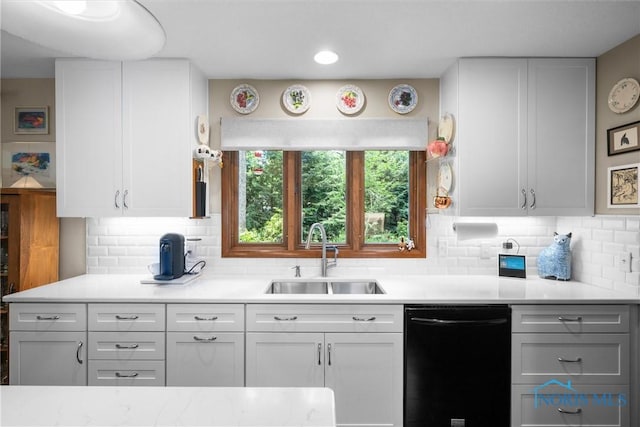 7118 Jamesford Dr, Toledo, OH 43617 - kitchen with black dishwasher, light countertops, and white cabinetry