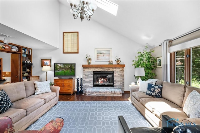 7118 Jamesford Dr, Toledo, OH 43617 - living area with a chandelier, a brick fireplace, dark wood-style flooring, and high vaulted ceiling