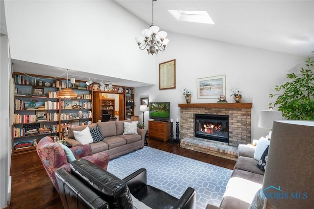 7118 Jamesford Dr, Toledo, OH 43617 - living area with wood finished floors, a chandelier, a fireplace, a skylight, and high vaulted ceiling