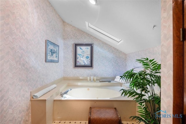 7118 Jamesford Dr, Toledo, OH 43617 - full bath featuring a skylight, wallpapered walls, vaulted ceiling, and a bath