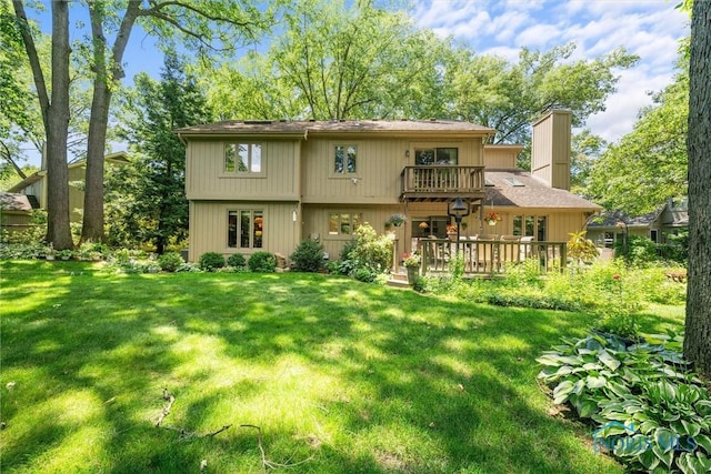 7118 Jamesford Dr, Toledo, OH 43617 - rear view of property with a lawn, a deck, a chimney, and a balcony