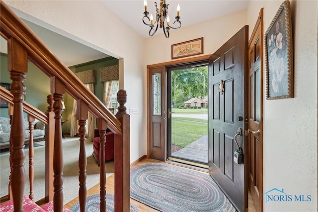 706 Grandview Ct, Elmore, OH 43416 - entryway featuring a chandelier and stairs