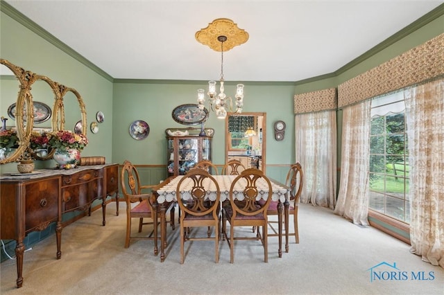 706 Grandview Ct, Elmore, OH 43416 - dining area featuring carpet, ornamental molding, a chandelier, and wainscoting
