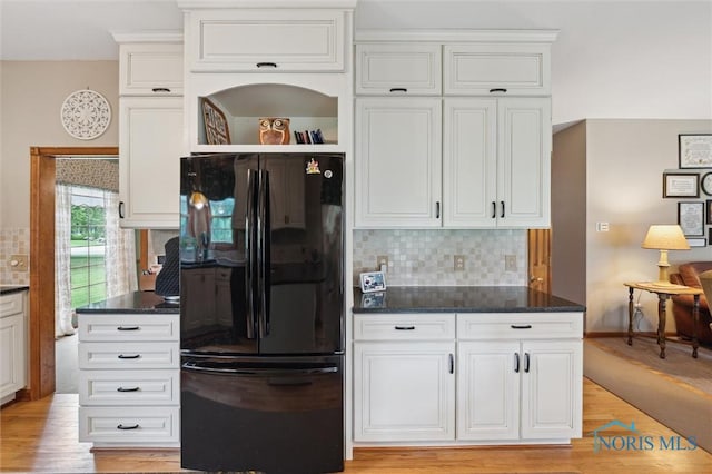 706 Grandview Ct, Elmore, OH 43416 - kitchen featuring freestanding refrigerator, decorative backsplash, open shelves, and white cabinetry